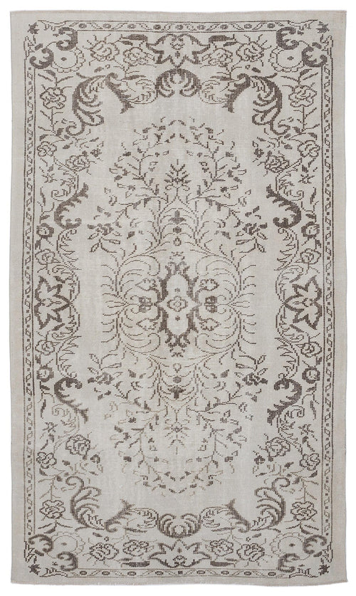 Load image 1 in gallery view. Light beige rug with a dark brown floral medallion and ornate botanical border pattern.