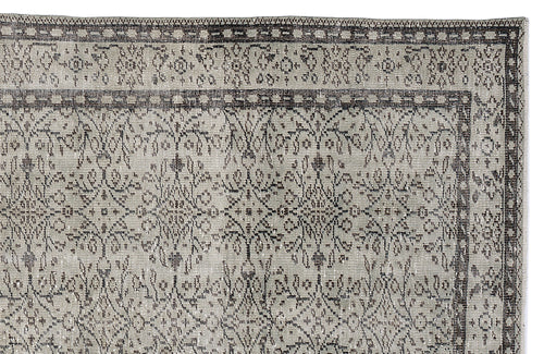 Load image 1 in gallery view. Grey and charcoal distressed rug with a traditional floral medallion pattern and a geometric border.