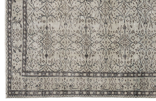 Load image 1 in gallery view. Beige and charcoal grey rug with a distressed traditional floral medallion pattern and a geometric border.