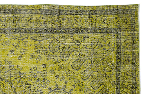 Load image 1 in gallery view. Chartreuse and black distressed rug with a traditional floral medallion pattern and a detailed border.