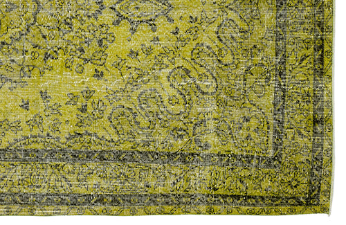 Load image 1 in gallery view. Chartreuse and black distressed rug with a traditional floral medallion pattern and a geometric border.