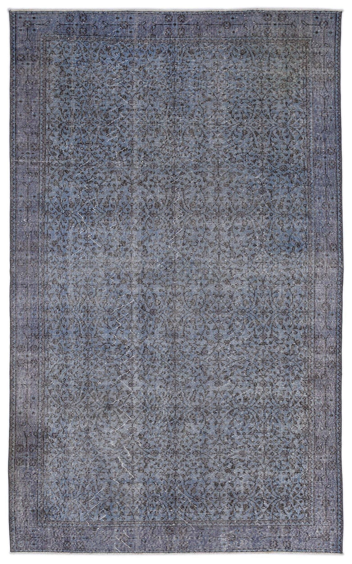 Slate blue and charcoal distressed vintage-style rug with an intricate all-over floral pattern and a bordered edge.