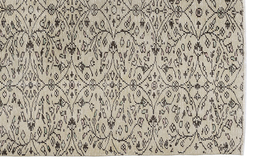 Load image 1 in gallery view. Beige rug with a dark brown diamond lattice pattern featuring small floral and geometric motifs.