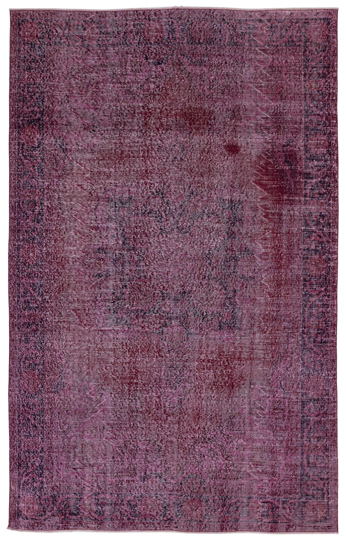 Deep magenta and black distressed vintage-style rug with a central medallion and ornate border.