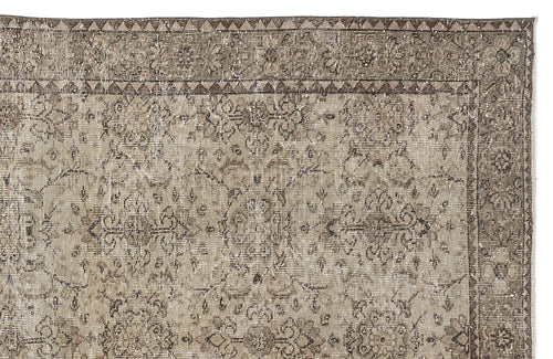 Load image 1 in gallery view. Taupe and brown distressed vintage-style rug with a traditional floral medallion pattern and geometric border.