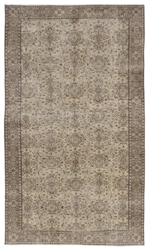 Load image 1 in gallery view. Taupe and brown distressed rug with a traditional floral medallion pattern and a geometric border.