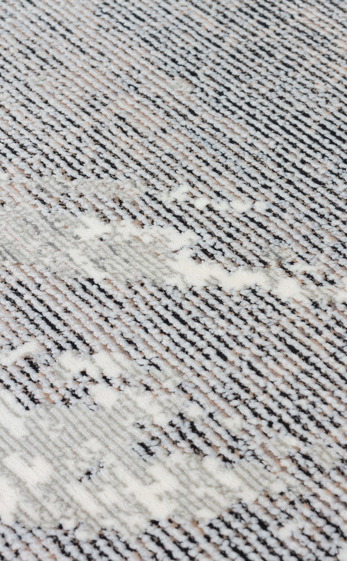 Black, white, and grey textured rug with a linear, distressed abstract pattern.