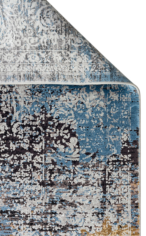 Bild 1 in Galerieansicht laden. Blue, grey, and charcoal distressed abstract rug with a folded corner on a white background.