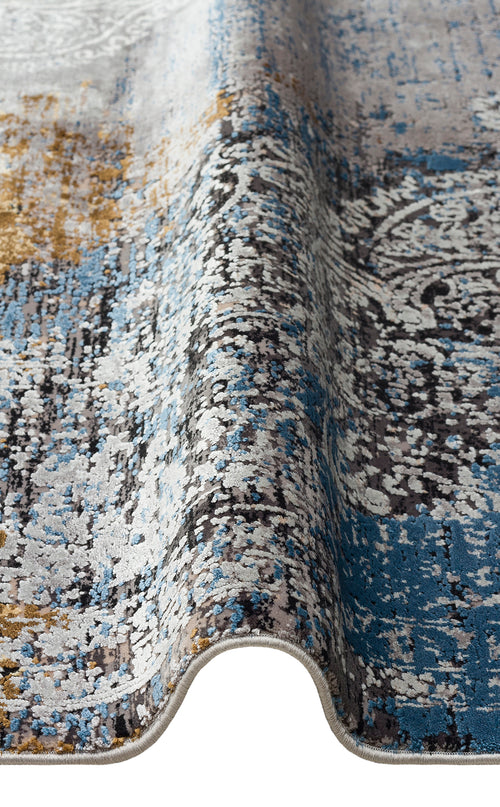 Bild 1 in Galerieansicht laden. Blue, grey, and gold abstract distressed rug with a partial traditional medallion pattern.