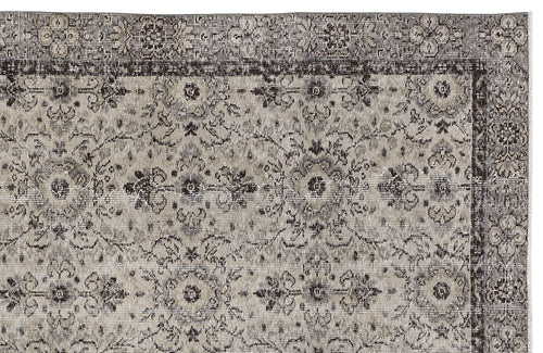 Load image 1 in gallery view. Charcoal and beige traditional rug with a distressed floral medallion pattern and a detailed border.