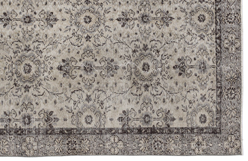 Load image 1 in gallery view. Grey and charcoal distressed rug with a traditional floral medallion pattern and a wide decorative border.