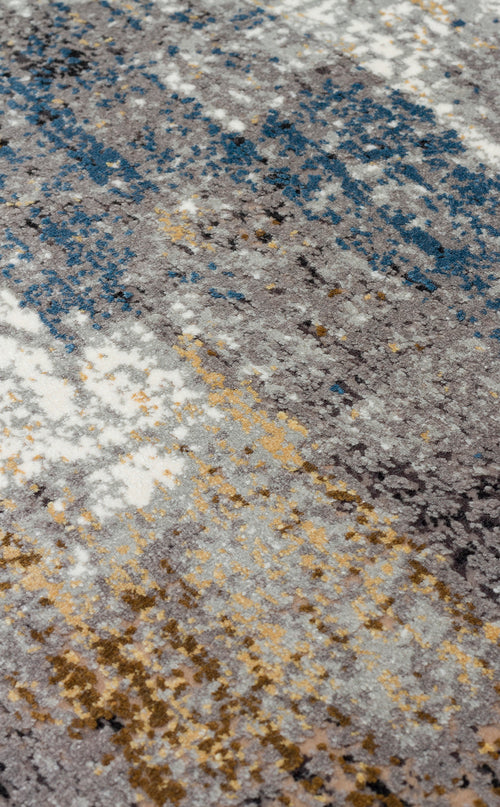 Load image 1 in gallery view. Grey, blue, and gold abstract area rug with a distressed, textured pile.