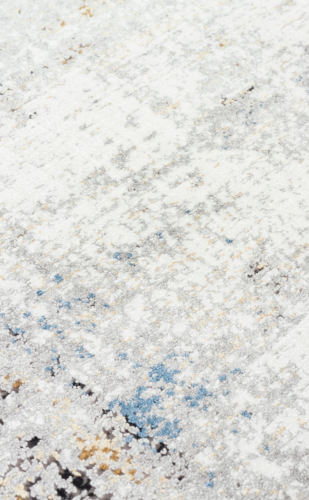 White, grey, and blue abstract distressed rug with subtle gold accents.