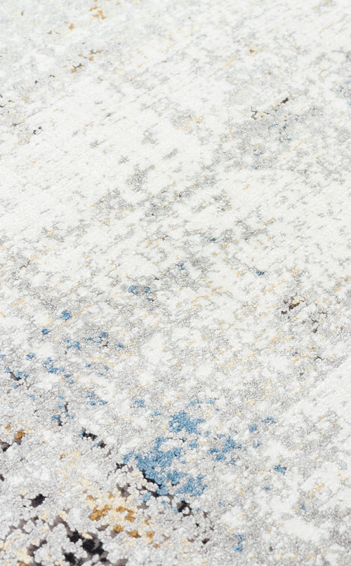 Load image 1 in gallery view. White, grey, and blue abstract distressed rug with subtle gold accents.