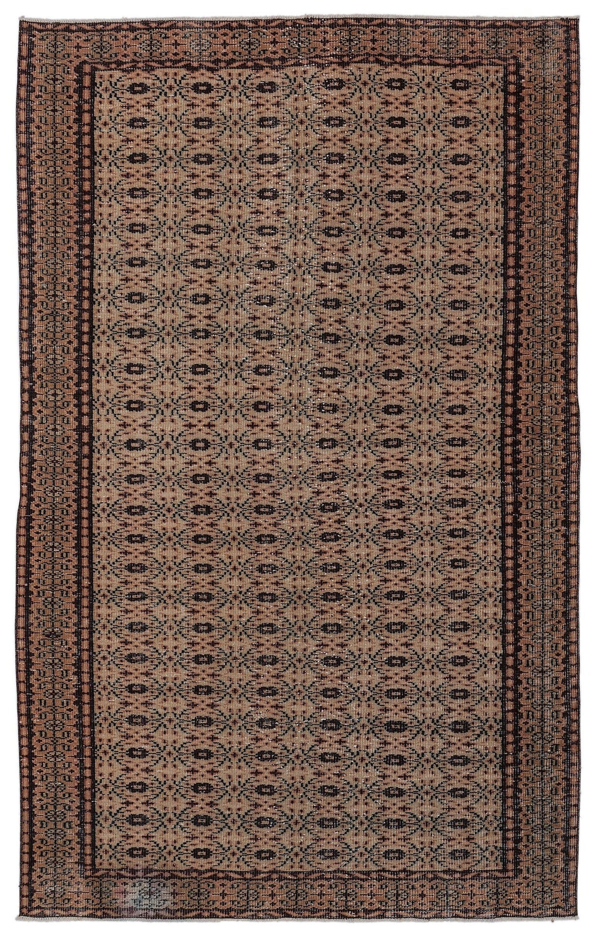Tan and black traditional rug with a repeating geometric lattice pattern and a dark bordered edge.