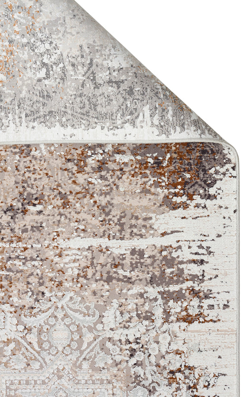 Load image 1 in gallery view. Grey, beige, and rust-colored area rug with a distressed, abstract medallion pattern and a folded corner.