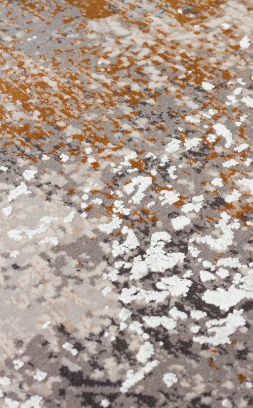 Load image 1 in gallery view. Abstract rug with a textured, distressed pattern in shades of grey, white, and burnt orange.