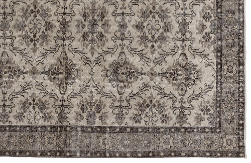 Load image 1 in gallery view. Taupe and dark brown rug with a traditional floral medallion pattern and a wide, detailed border.