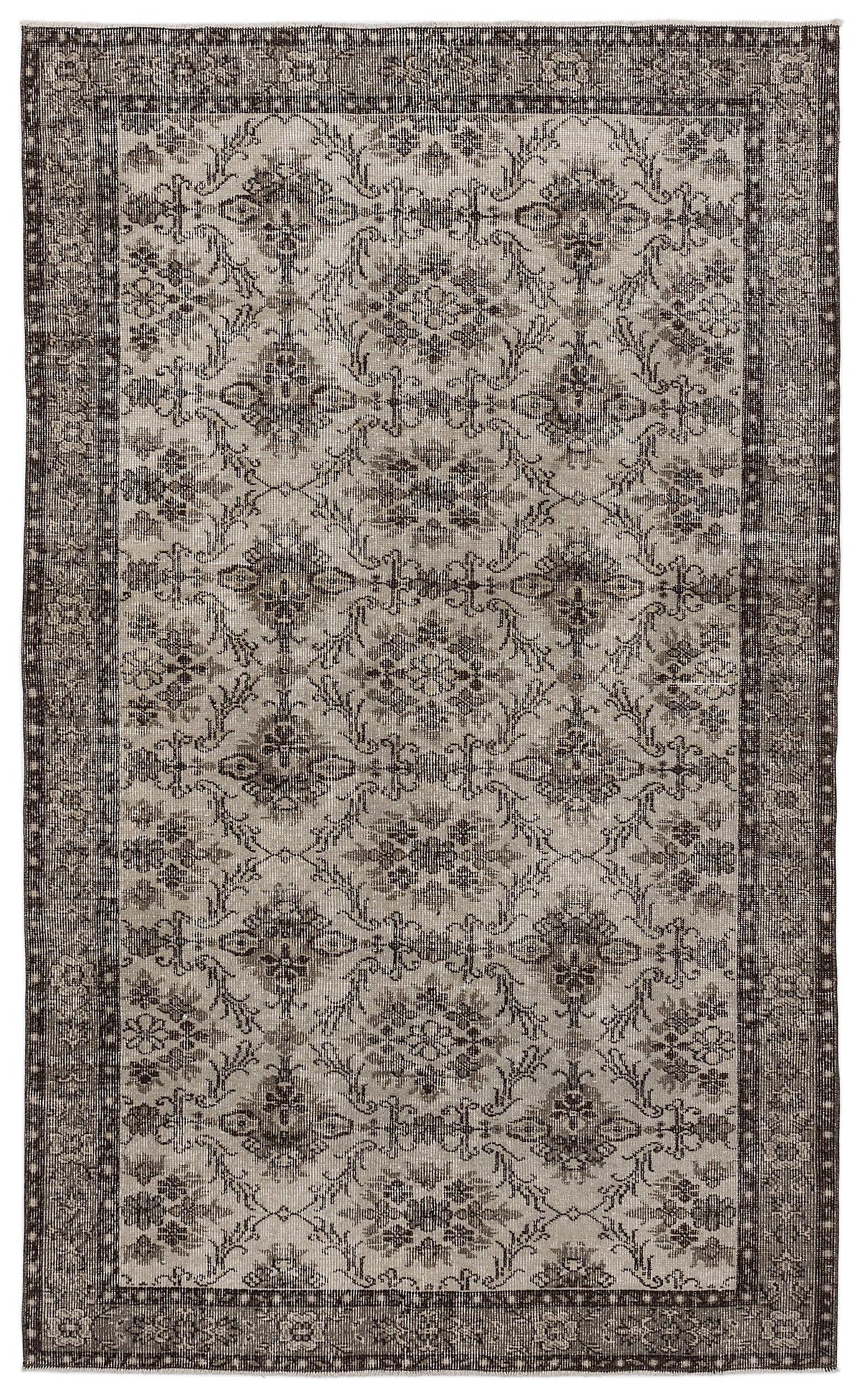 Charcoal and light gray vintage-style rug with a repeating floral medallion pattern and a wide decorative border.