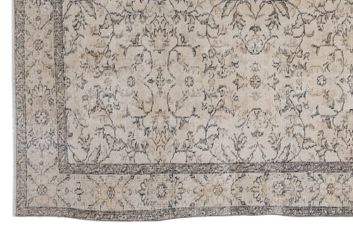 Load image 1 in gallery view. Beige and charcoal grey rug with a distressed traditional floral medallion pattern and a detailed border.