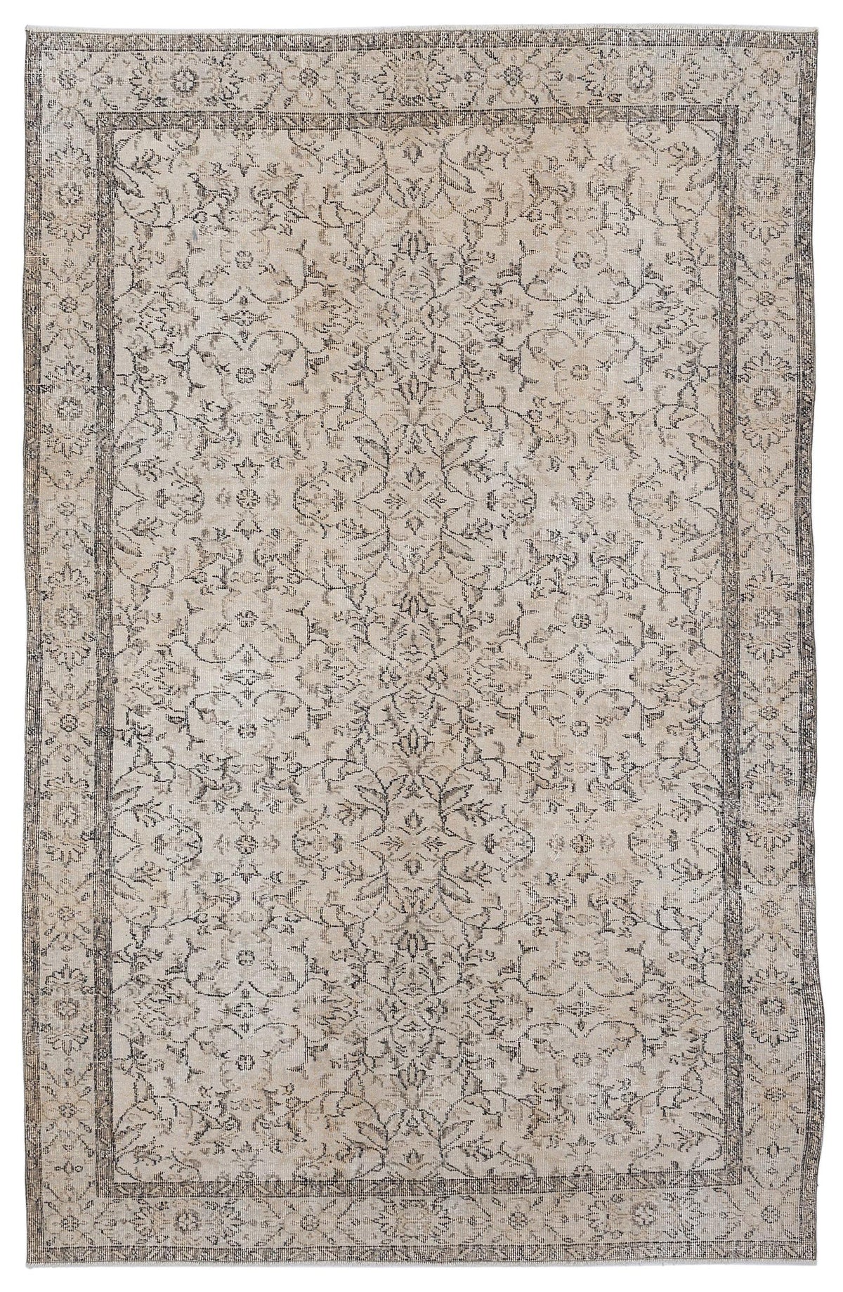 Beige and charcoal grey vintage-style rug with a distressed floral medallion pattern and a detailed border.