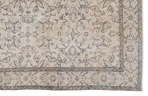 Load image 1 in gallery view. Beige and charcoal grey rug with a distressed traditional floral medallion pattern and a detailed border.