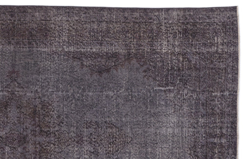 Load image 1 in gallery view. Charcoal grey rug with a distressed, faded traditional medallion pattern and a linear textured weave.