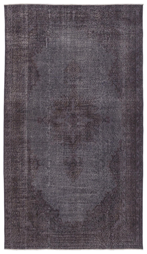 Load image 1 in gallery view. Dark charcoal distressed rug with a faded traditional medallion pattern and a bordered edge.