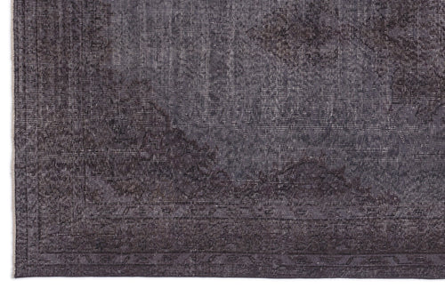 Load image 1 in gallery view. Charcoal grey rug with a distressed, faded traditional medallion pattern and a linear border.