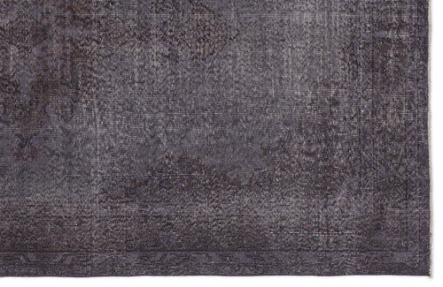 Load image 1 in gallery view. Charcoal grey rug with a distressed, faded traditional medallion pattern and a linear border.