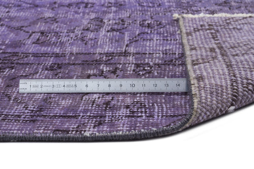 Load image 1 in gallery view. Distressed purple rug with a dark grey floral pattern, shown with a metal ruler for scale on a white background.