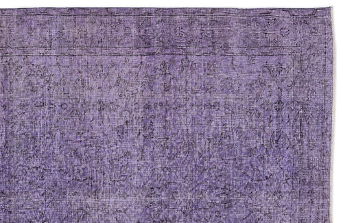 Load image 1 in gallery view. Deep purple vintage-style rug with a distressed, faded floral medallion pattern and a linear border.