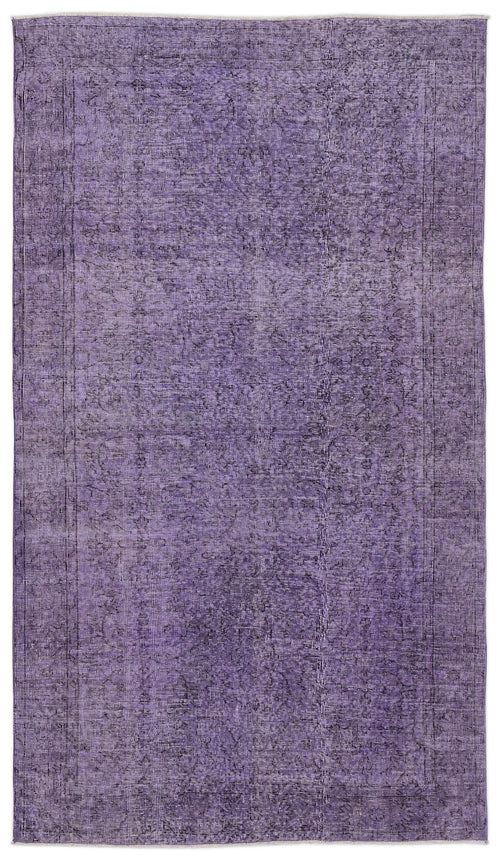 Load image 1 in gallery view. Purple distressed vintage-style rug with a faded traditional floral medallion pattern on a white background.