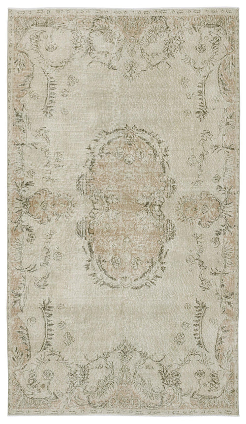 Load image 1 in gallery view. Beige and taupe distressed traditional rug with a central floral medallion and ornate border pattern.