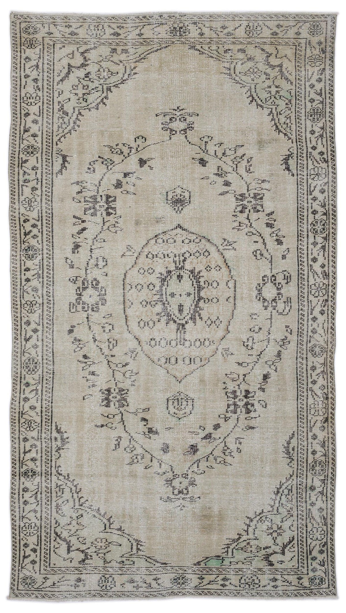 Beige and charcoal distressed vintage-style rug with a central medallion and ornate floral border.