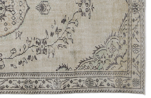 Load image 1 in gallery view. Beige and charcoal grey vintage-style rug with a distressed floral medallion pattern and a detailed border.
