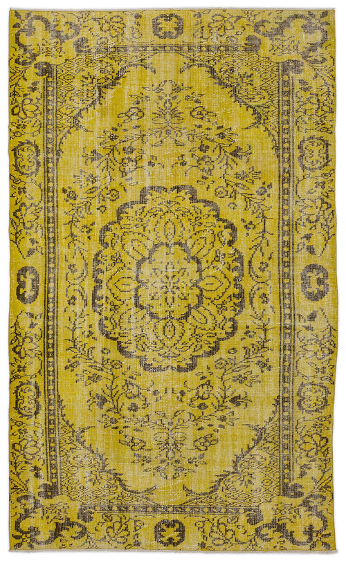 Load image 1 in gallery view. Mustard yellow and charcoal grey traditional rug with a central floral medallion and distressed border pattern.