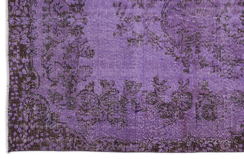 Load image 1 in gallery view. Distressed purple rug with a dark charcoal floral medallion pattern and ornate border.