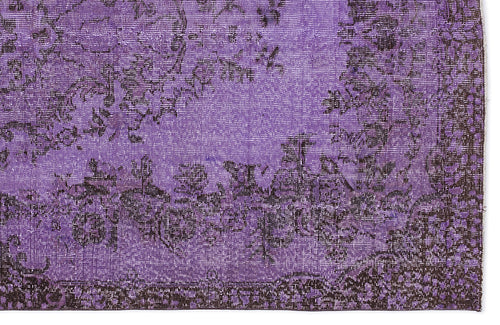 Load image 1 in gallery view. Deep purple and black distressed rug with a traditional floral medallion pattern.