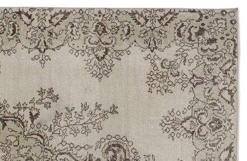 Load image 1 in gallery view. Beige rug with a dark brown distressed floral and vine pattern.