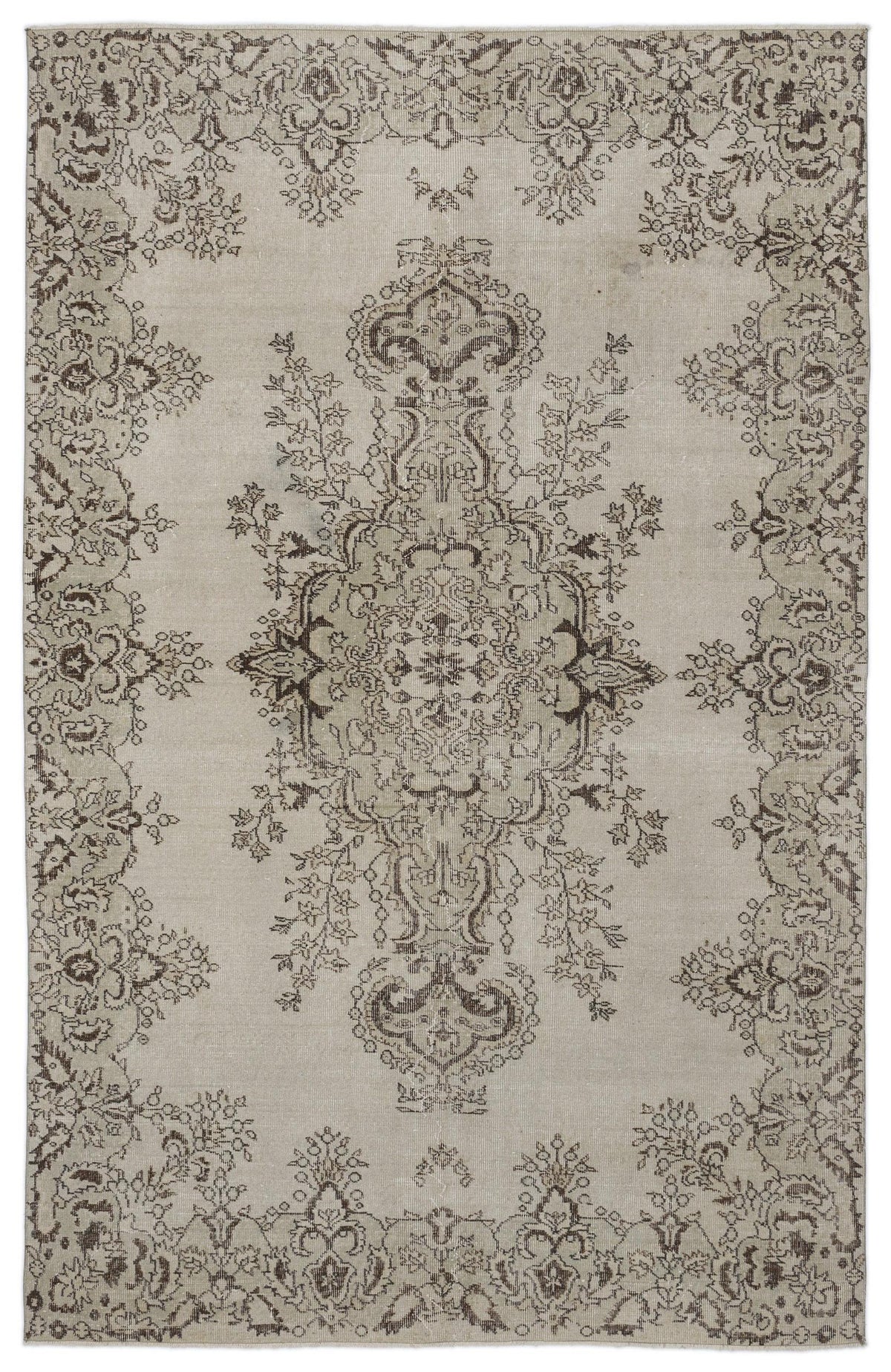 Beige and brown vintage-style rug with a distressed central floral medallion and ornate border pattern.
