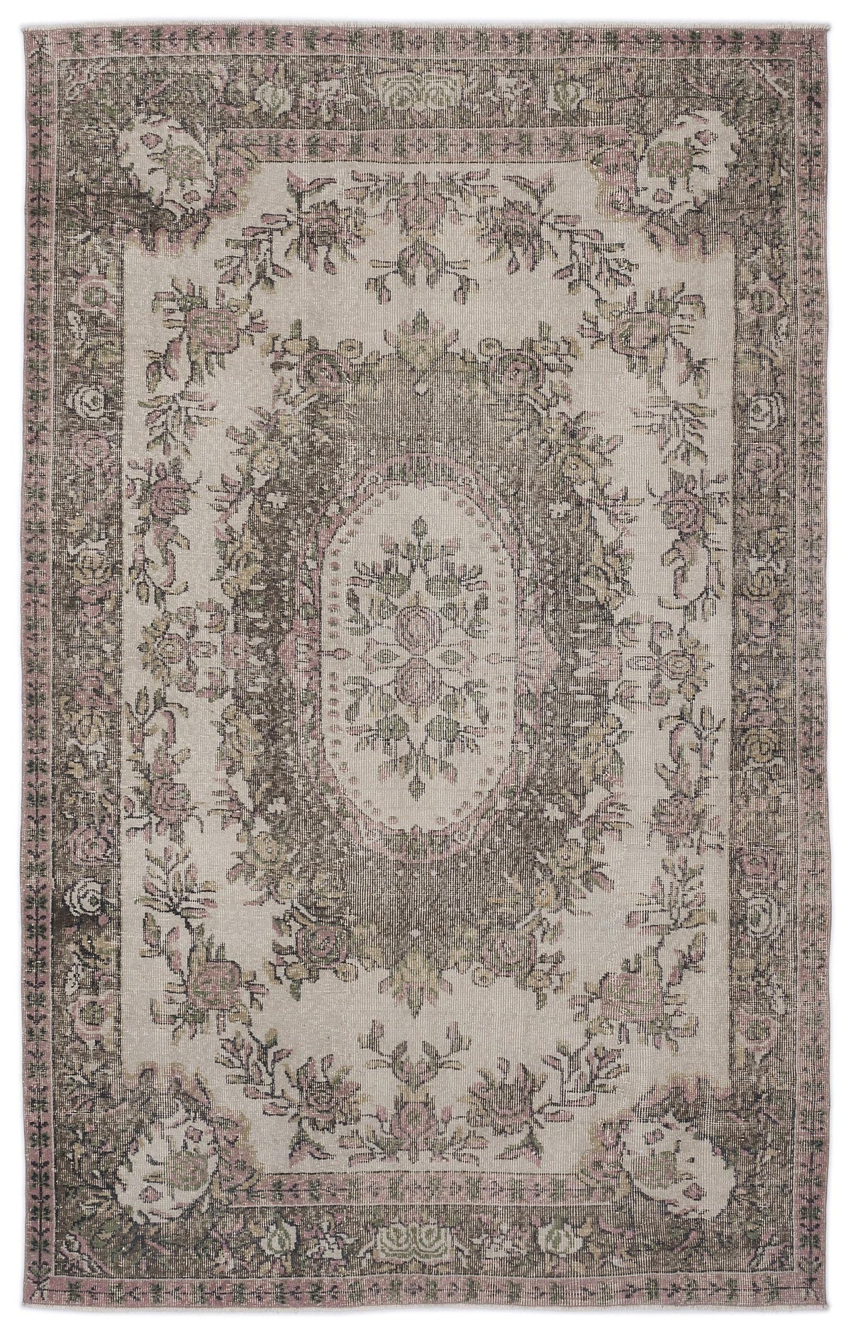 Distressed beige, brown, and muted pink rug with a central floral medallion and ornate botanical border.