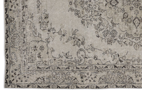 Load image 1 in gallery view. Distressed beige and charcoal grey rug with a traditional floral medallion pattern and ornate border.