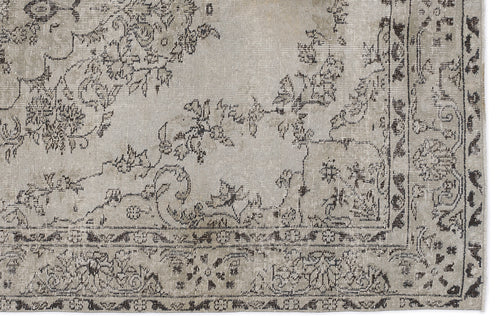 Load image 1 in gallery view. Distressed beige and charcoal grey rug with a traditional floral medallion pattern and a detailed border.