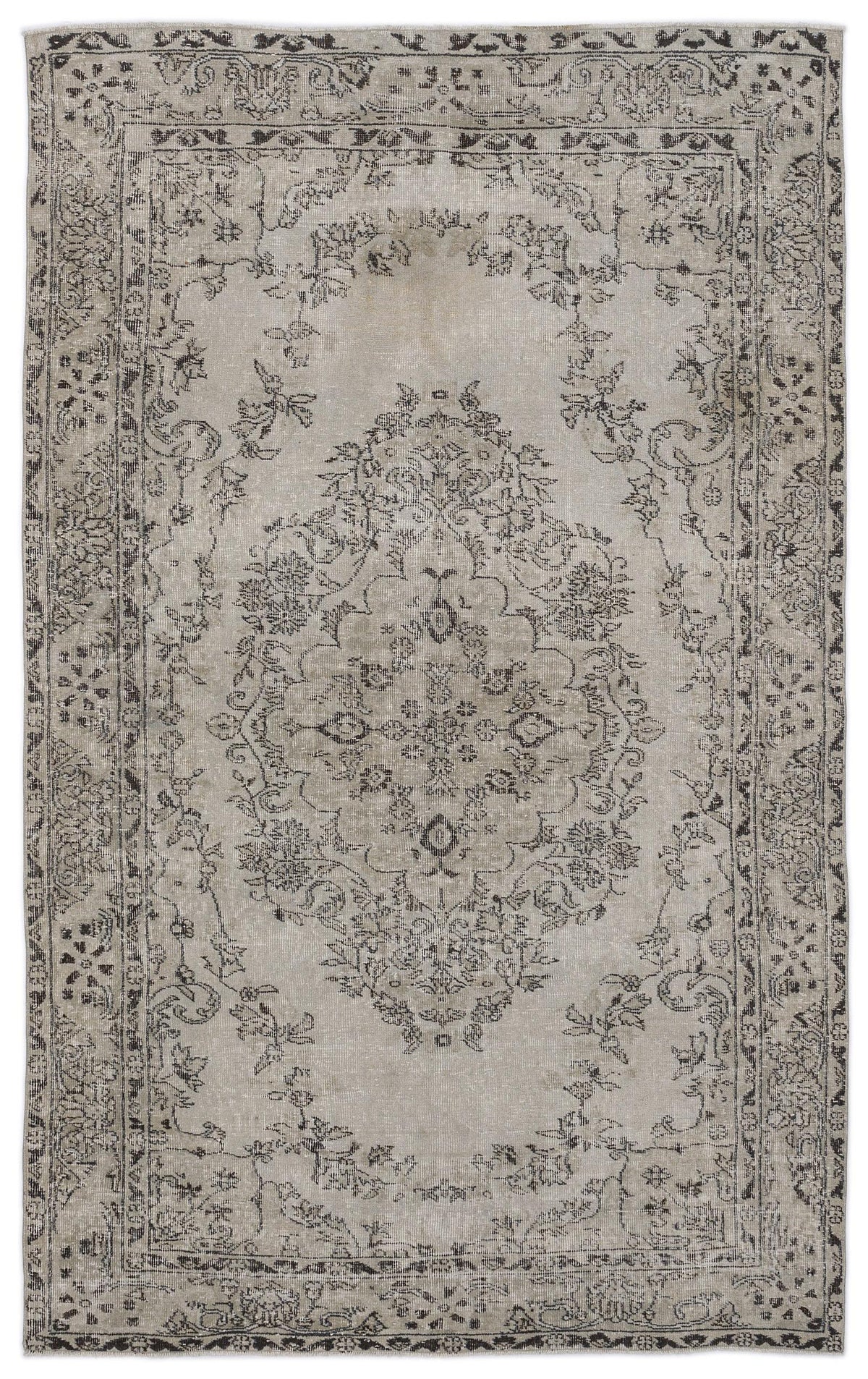 Light gray vintage-style rug with a dark charcoal floral medallion and ornate border on a white background.