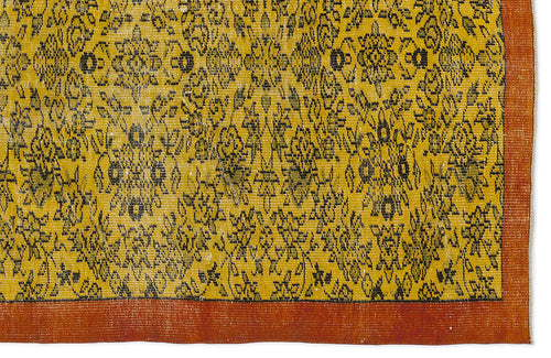 Load image 1 in gallery view. Mustard yellow rug with a black floral medallion pattern and a solid burnt orange border.