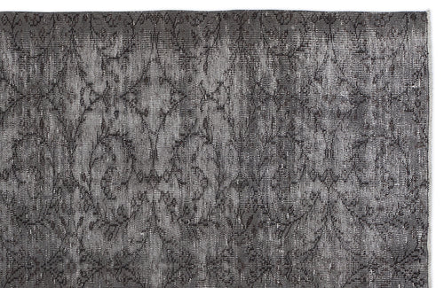 Load image 1 in gallery view. Charcoal grey rug with a distressed, repeating damask pattern on a white background.