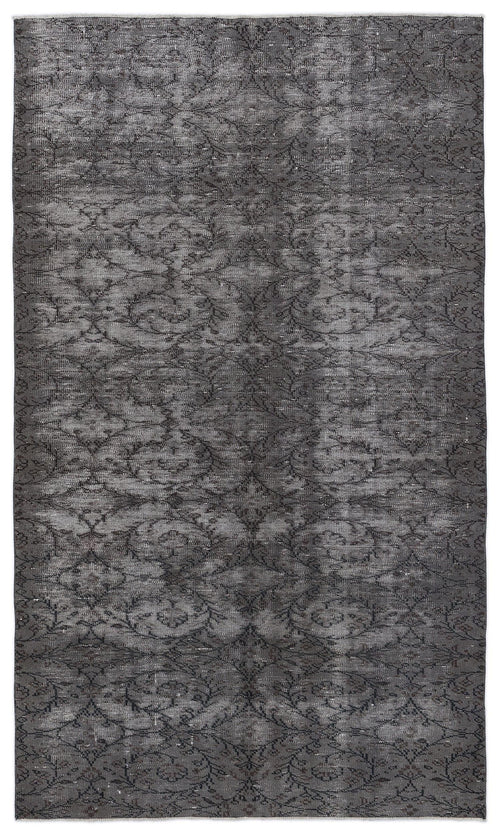 Load image 1 in gallery view. Charcoal grey vintage-style rug with a distressed, repeating floral vine pattern on a white background.