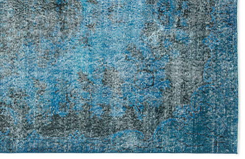 Load image 1 in gallery view. Blue and black distressed rug with a faded, abstract traditional pattern on a white background.