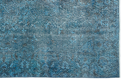 Load image 1 in gallery view. Deep blue distressed rug with a faded traditional floral medallion pattern and visible woven texture.